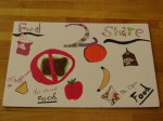 Food2Share cafeteria sign with student drawn images of foods that can and cannot be donated.